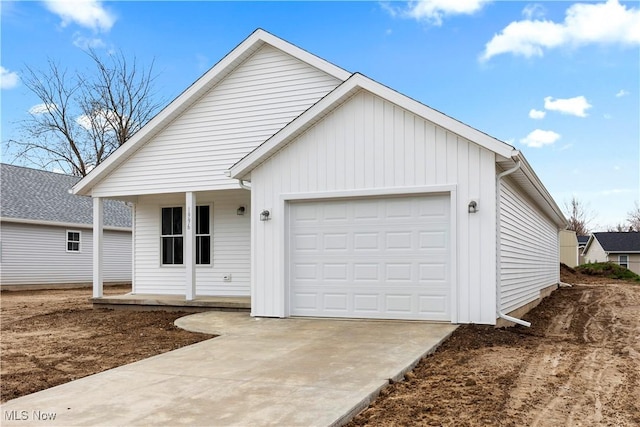 1996 E Oldgate Rd, Sandusky, OH 44870 - view of front of property featuring an attached garage, board and batten siding, and concrete driveway