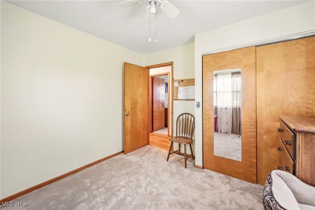 bedroom featuring a closet, baseboards, a ceiling fan, and carpet floors