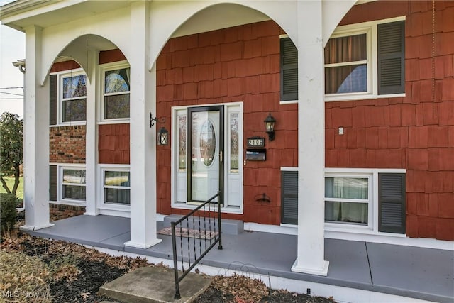 entrance to property featuring a porch