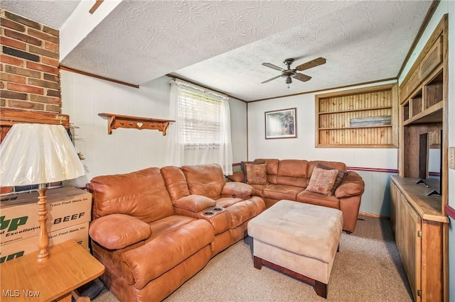 living area featuring a textured ceiling and a ceiling fan