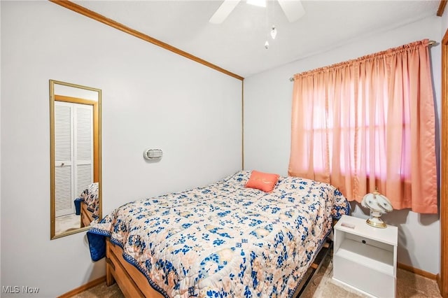 bedroom featuring ceiling fan and baseboards
