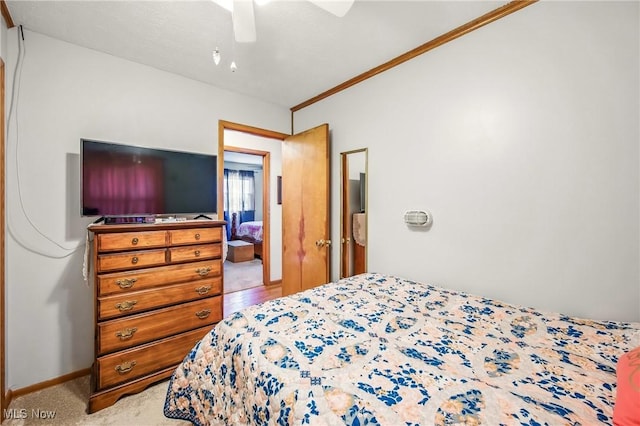 bedroom with crown molding and a ceiling fan