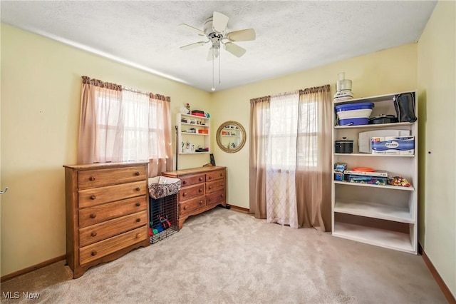 bedroom featuring carpet flooring, baseboards, and multiple windows