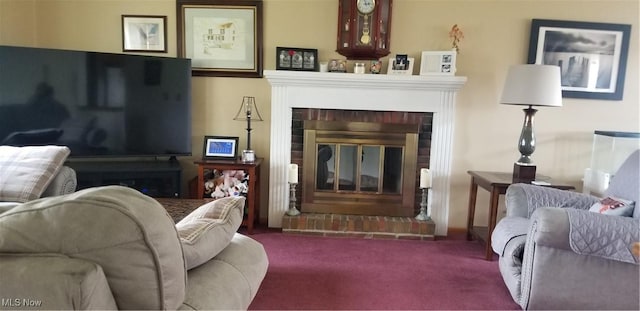 living area featuring carpet flooring and a brick fireplace