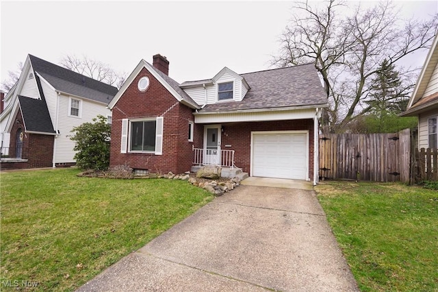view of front of house featuring driveway, a front yard, brick siding, a garage, and fence