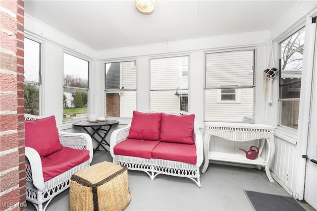 sunroom with finished concrete flooring and a wealth of natural light