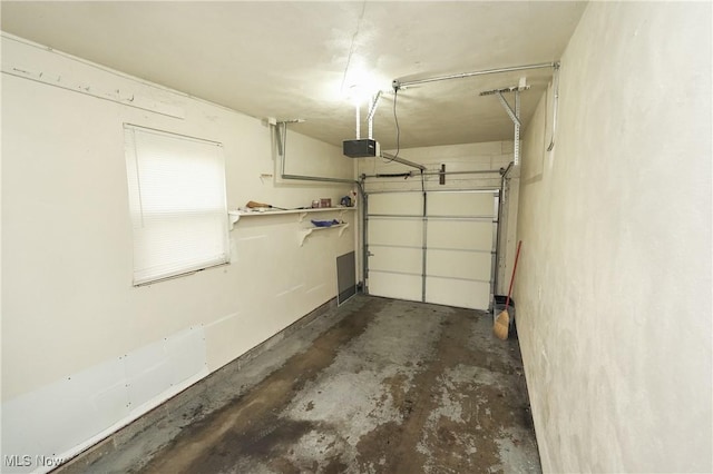 garage featuring a garage door opener