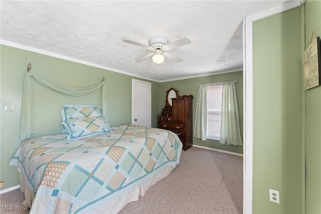 carpeted bedroom featuring a textured ceiling, ceiling fan, and ornamental molding