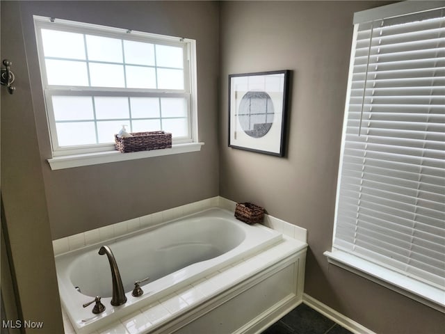 full bath with a garden tub