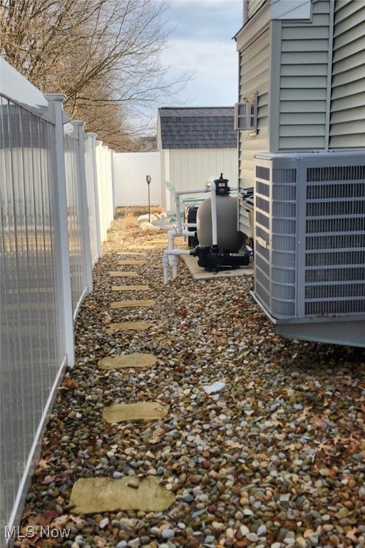 view of yard with a fenced backyard and cooling unit
