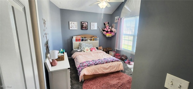 carpeted bedroom featuring a ceiling fan and lofted ceiling