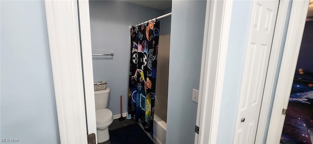full bathroom featuring toilet and tile patterned floors