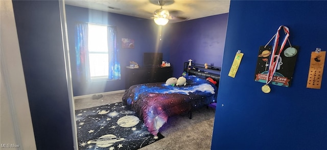 bedroom with carpet flooring and baseboards