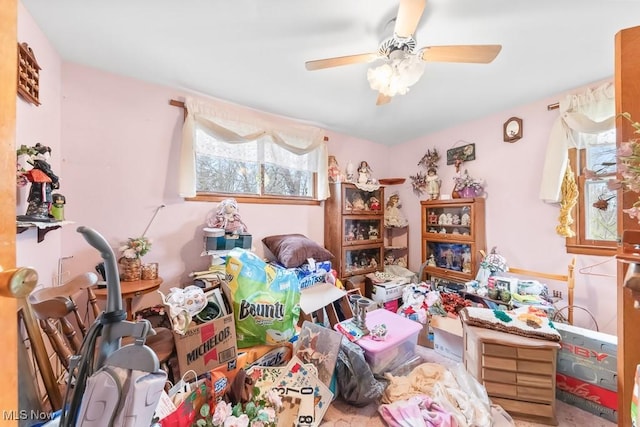 misc room with a ceiling fan