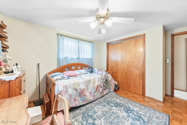bedroom featuring a closet, ceiling fan, and baseboards