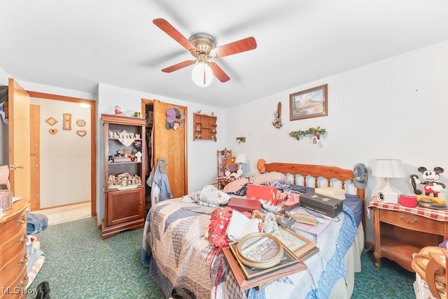 bedroom with ceiling fan and carpet floors