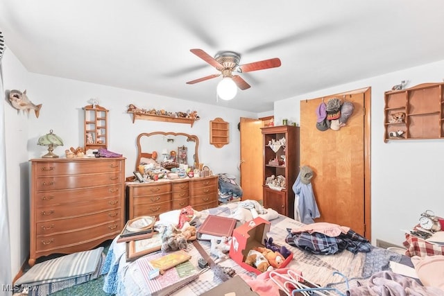 bedroom with a closet and a ceiling fan