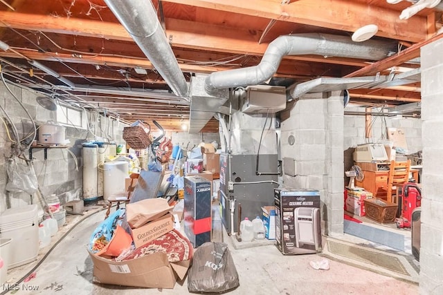 unfinished below grade area featuring heating unit