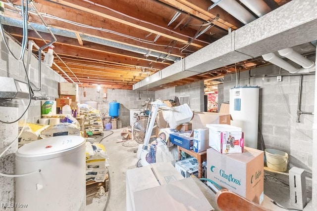 unfinished basement featuring water heater