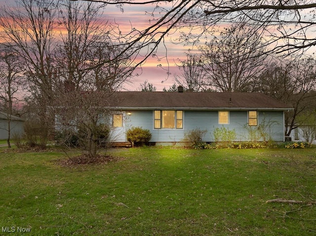 ranch-style home featuring crawl space and a front lawn