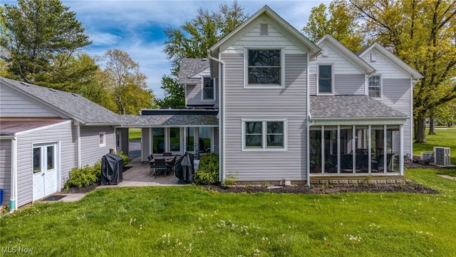 3032 W Erie Ave, Lorain, OH 44053 - back of property with a patio, roof with shingles, a yard, and central AC unit