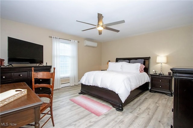 31 Morgan Ave, Ashland, OH 44805 - bedroom with light wood finished floors, a wall mounted air conditioner, and a ceiling fan