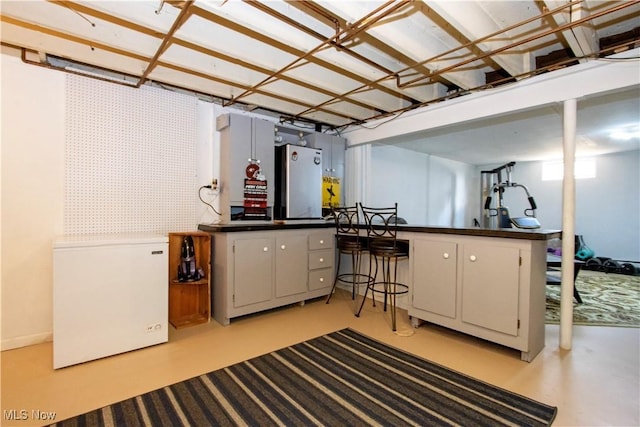 31 Morgan Ave, Ashland, OH 44805 - below grade area featuring fridge and freestanding refrigerator