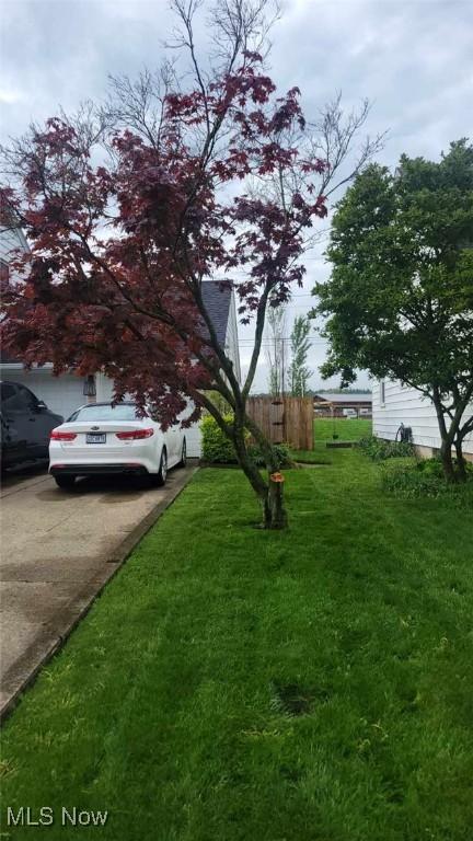 31 Morgan Ave, Ashland, OH 44805 - view of yard featuring concrete driveway and fence