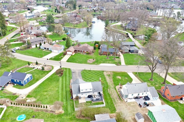 bird's eye view featuring a residential view and a water view