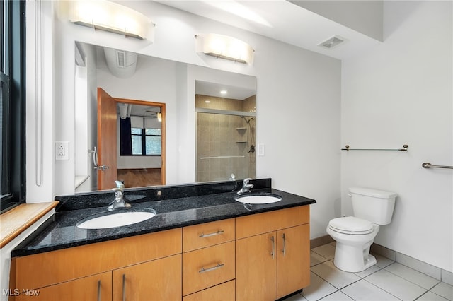 2077 E 4th St E Unit 4E, Cleveland, OH 44115 - full bathroom with a shower stall, visible vents, a sink, and toilet