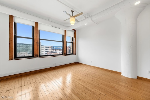 2077 E 4th St E Unit 4E, Cleveland, OH 44115 - empty room with baseboards, hardwood / wood-style floors, and ceiling fan
