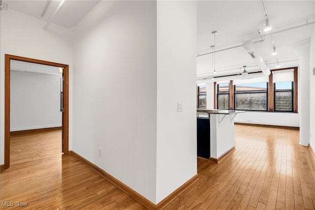 2077 E 4th St E Unit 4E, Cleveland, OH 44115 - hallway with track lighting, light wood-style flooring, and baseboards