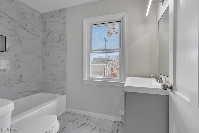 bathroom featuring toilet, marble finish floor, vanity, and baseboards