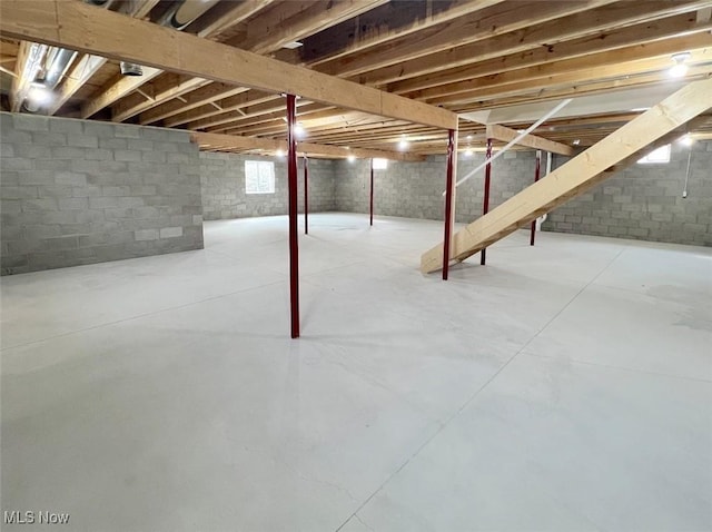 basement featuring stairs