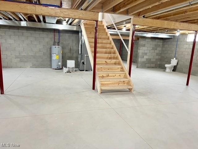below grade area with water heater and stairway