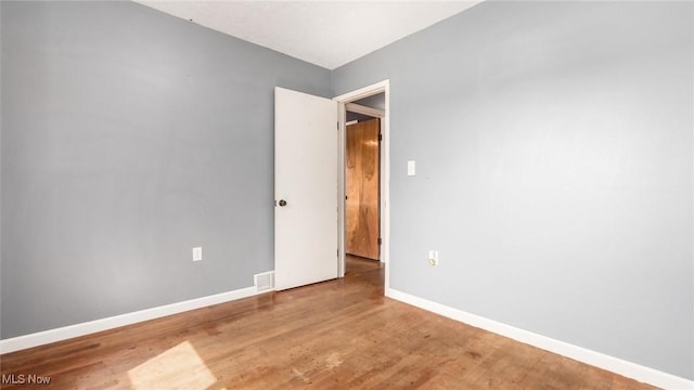 3020 State Route 376, Stockport, OH 43787 - empty room with wood finished floors, baseboards, and visible vents