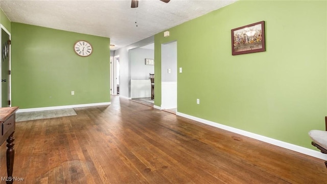 3020 State Route 376, Stockport, OH 43787 - empty room featuring wood-type flooring, a ceiling fan, and baseboards