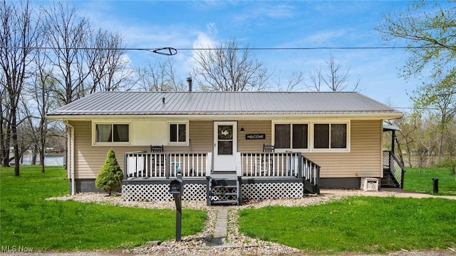 3020 State Route 376, Stockport, OH 43787 - view of front of house with a porch, metal roof, and a front lawn