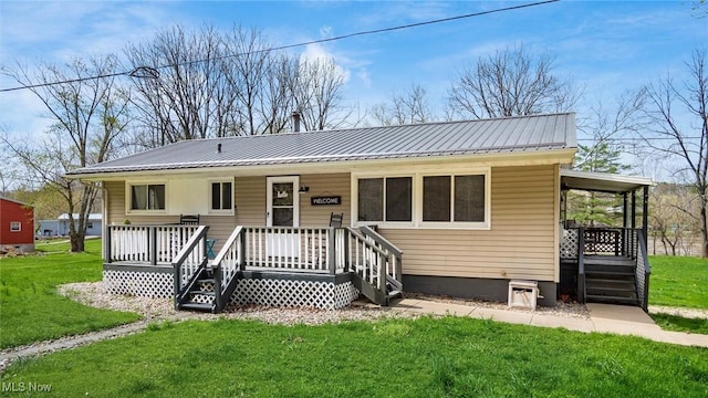 3020 State Route 376, Stockport, OH 43787 - view of front facade featuring covered porch, a front yard, and metal roof