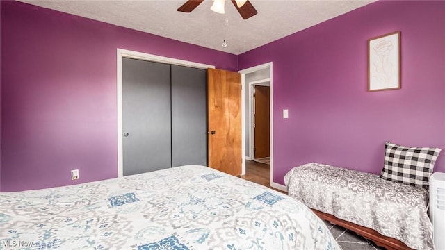 3020 State Route 376, Stockport, OH 43787 - bedroom with a closet, baseboards, a textured ceiling, and a ceiling fan