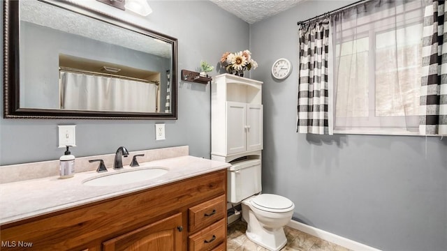 3020 State Route 376, Stockport, OH 43787 - full bath featuring toilet, a textured ceiling, vanity, and baseboards