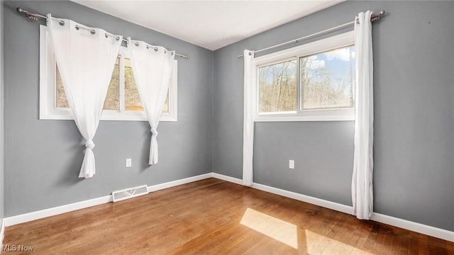 3020 State Route 376, Stockport, OH 43787 - spare room featuring wood finished floors, baseboards, and visible vents