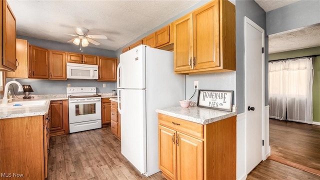 3020 State Route 376, Stockport, OH 43787 - kitchen featuring ceiling fan, white appliances, a textured ceiling, light countertops, and a sink
