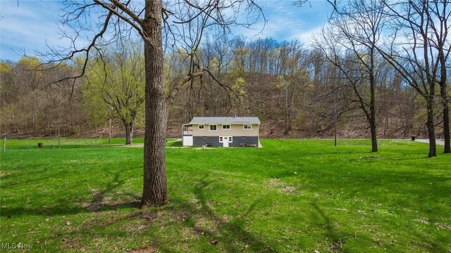 3020 State Route 376, Stockport, OH 43787 - view of yard with an outbuilding and a forest view