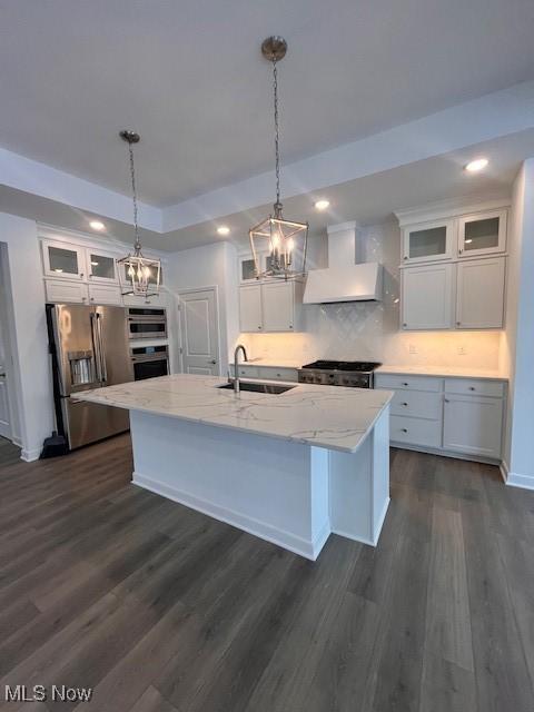 2176 Myla Way, Amherst, OH 44001 - kitchen featuring stainless steel appliances, dark wood-style floors, a sink, a notable chandelier, and custom range hood