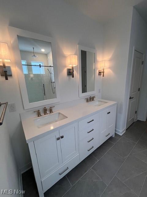 2176 Myla Way, Amherst, OH 44001 - full bathroom featuring a sink, a shower stall, and double vanity