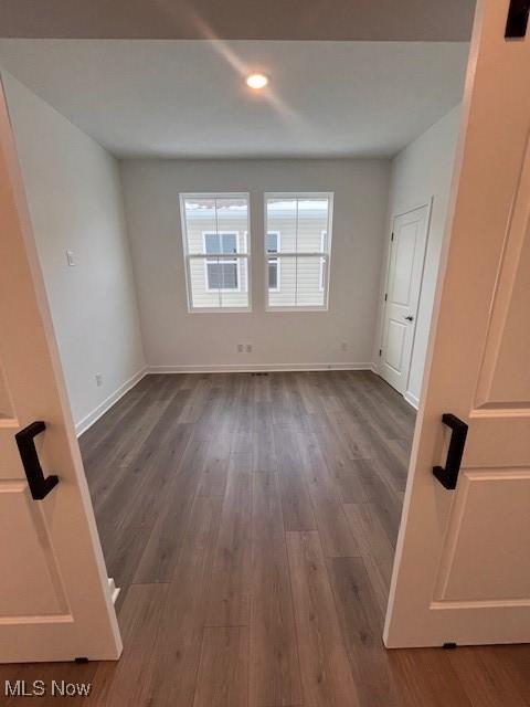2176 Myla Way, Amherst, OH 44001 - empty room with baseboards, recessed lighting, and dark wood-type flooring