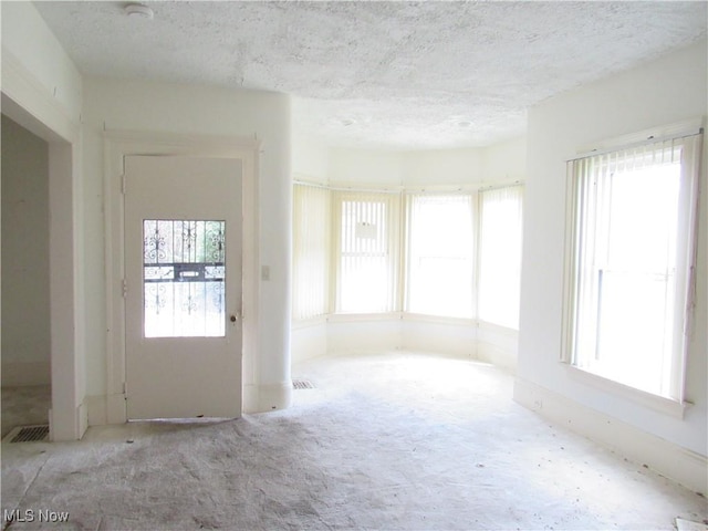 1831 Knowles St, East Cleveland, OH 44112 - unfurnished room with visible vents and a textured ceiling