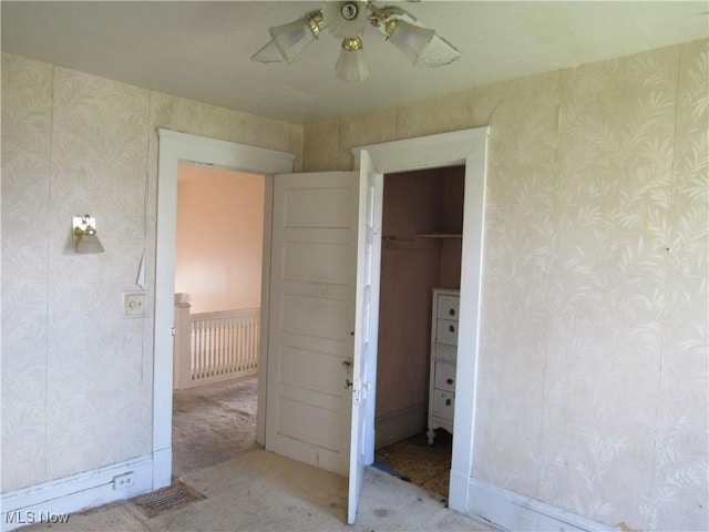 1831 Knowles St, East Cleveland, OH 44112 - unfurnished bedroom with light carpet, wallpapered walls, and visible vents