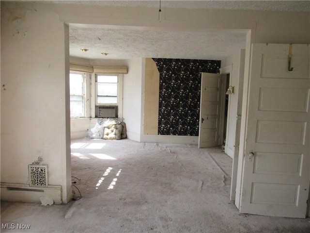 1831 Knowles St, East Cleveland, OH 44112 - unfurnished room with cooling unit and a textured ceiling